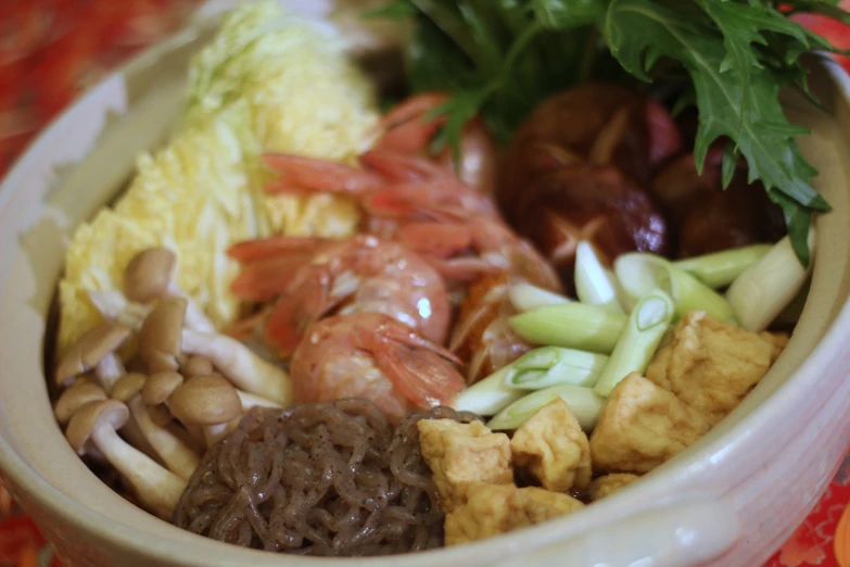 a bowl of food that is sitting on a table