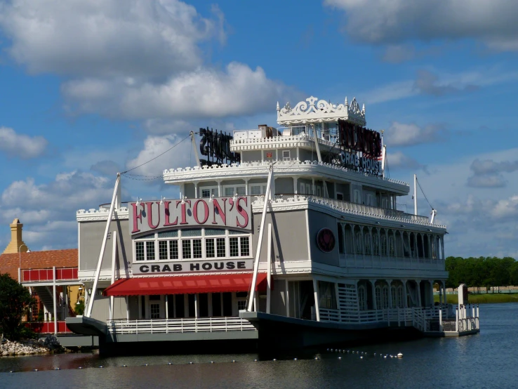 a large building sitting in the middle of a lake