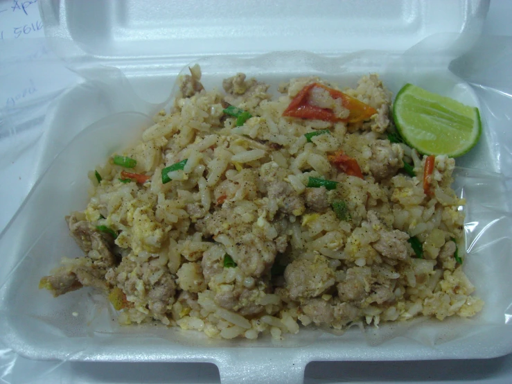 a small lunch tray with rice and meat