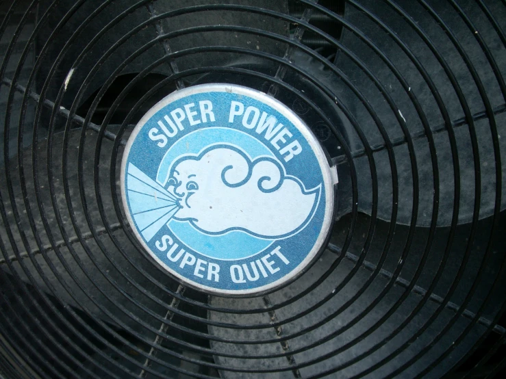 a blue and white sticker on the side of a fan