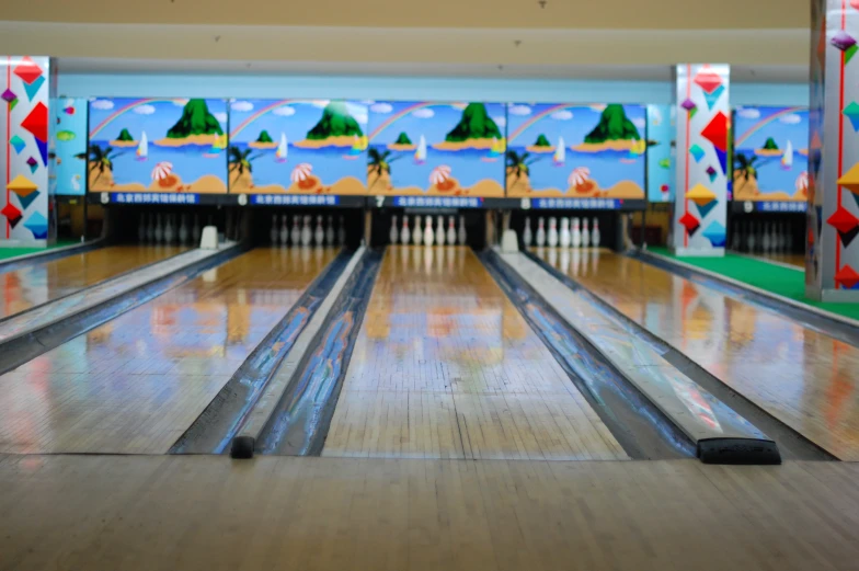 the bowling pins are facing down in a bowling court