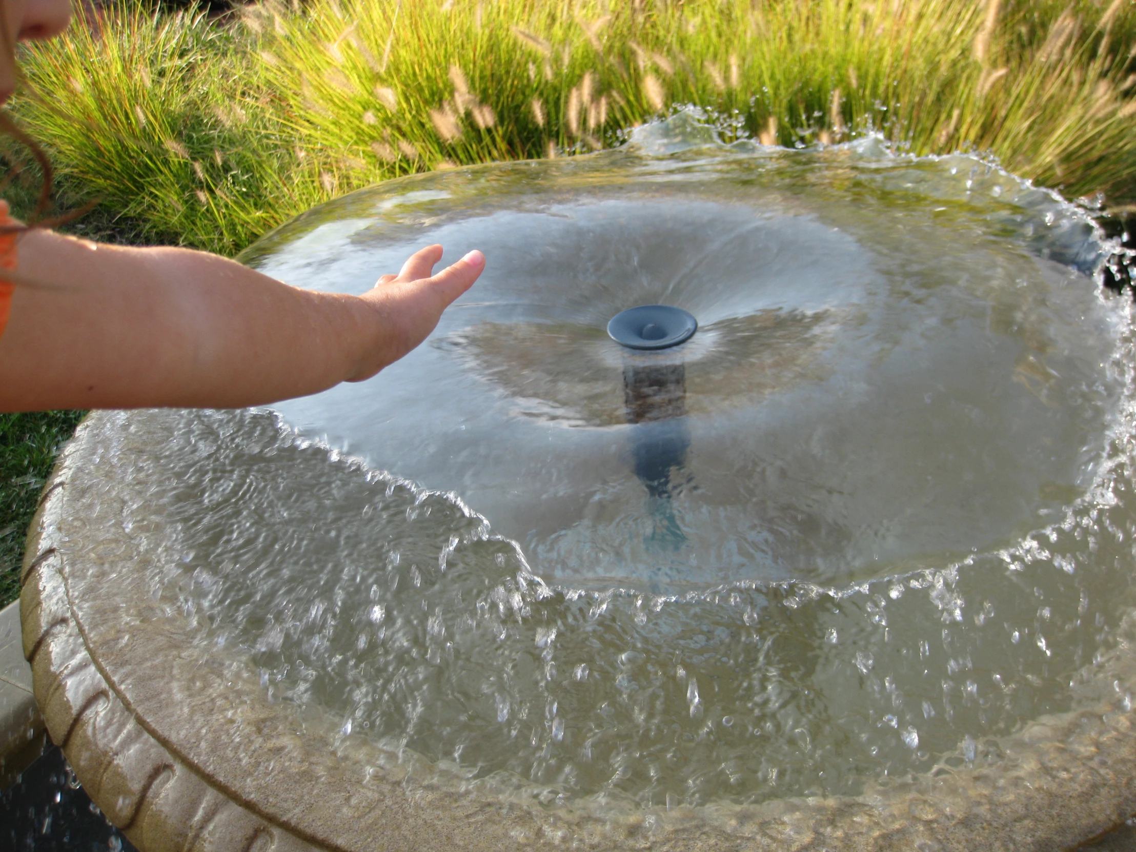 there is a fountain with water coming out of it