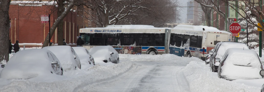 there is a bus that has been covered by the snow