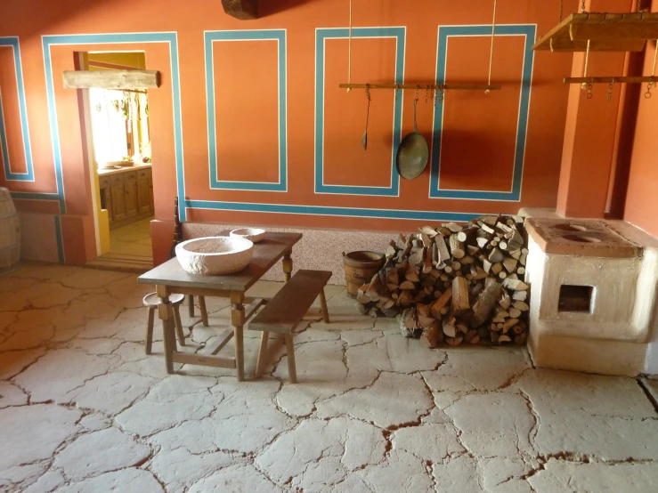 a stove top oven and chairs in a room