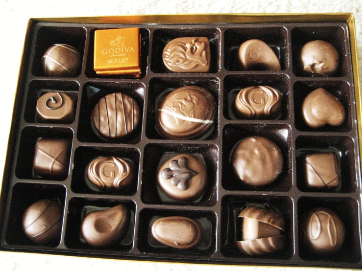 there are many chocolates on a tray in the box