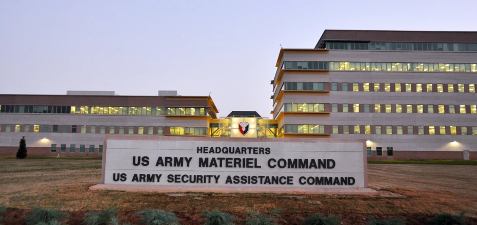 a sign stands in front of a building with several windows