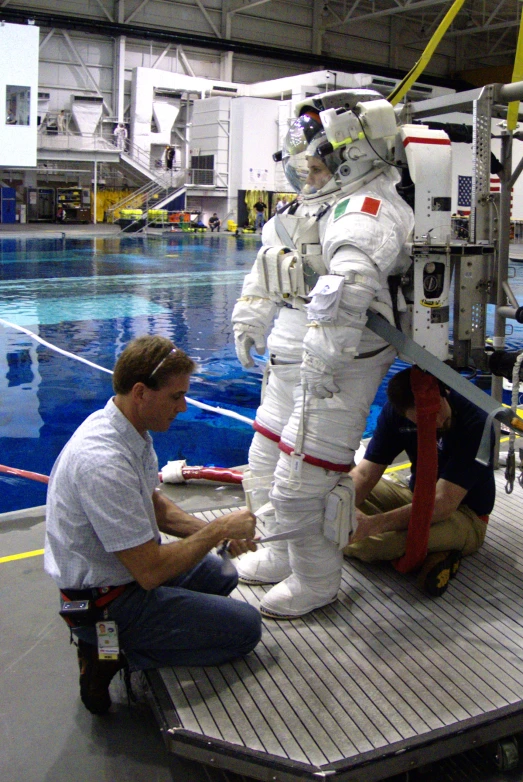 an assembly line for an astronaut suit on the ground