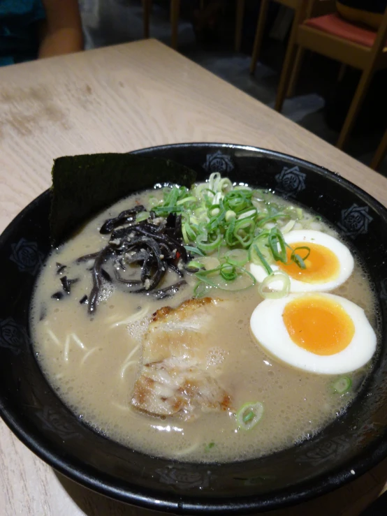 a bowl of soup sits on a table