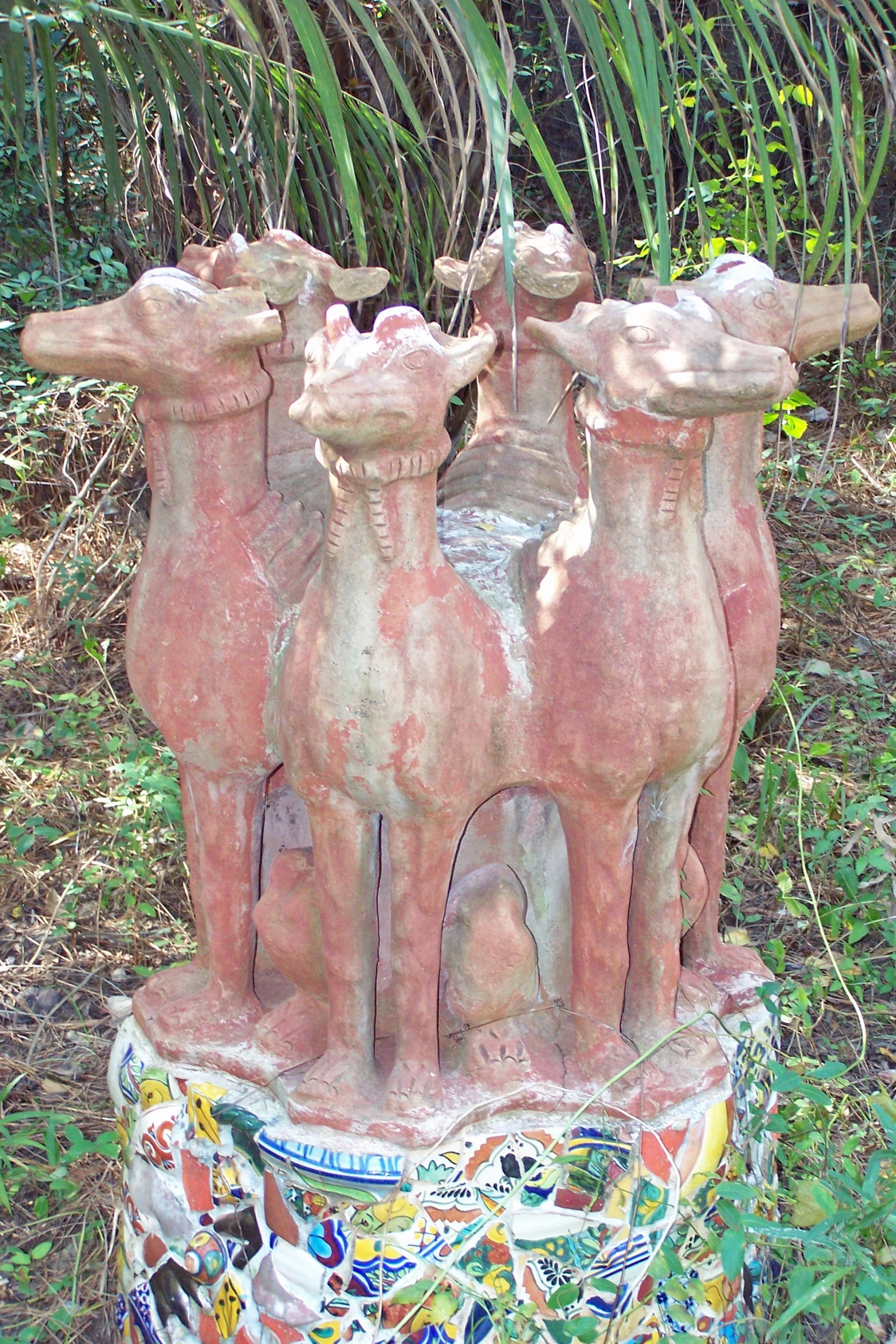 three stone dogs are on top of one another