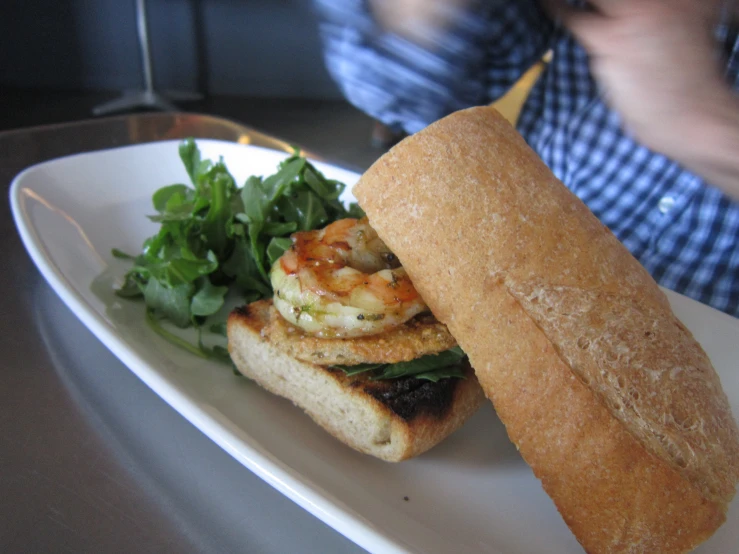 a plate topped with a sandwich on top of a white plate