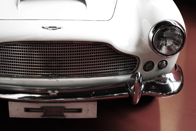 a close up view of the front of a white sports car