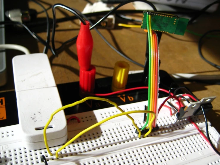 a breadboard with some colorful wires connected to it