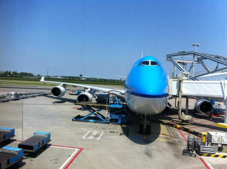 an airplane on the tarmac near the loading dock