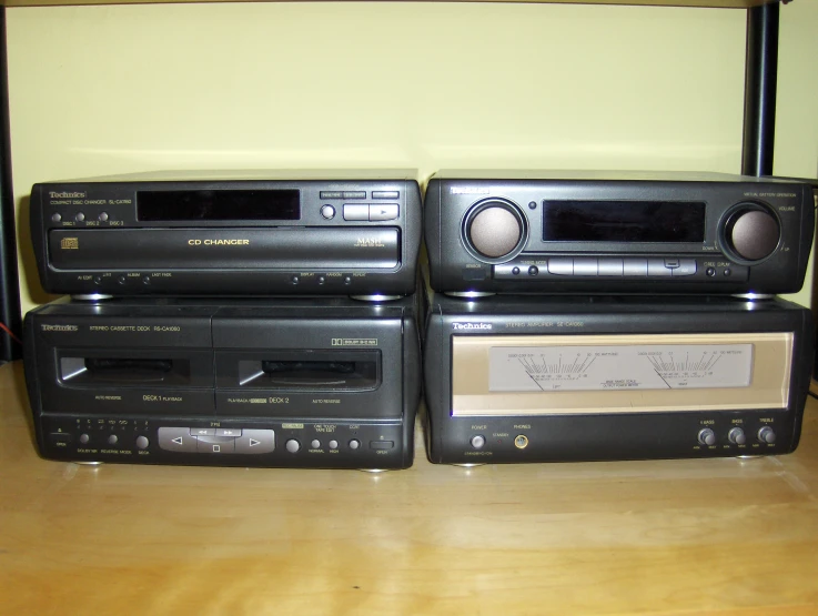 a collection of stereos stacked on top of each other