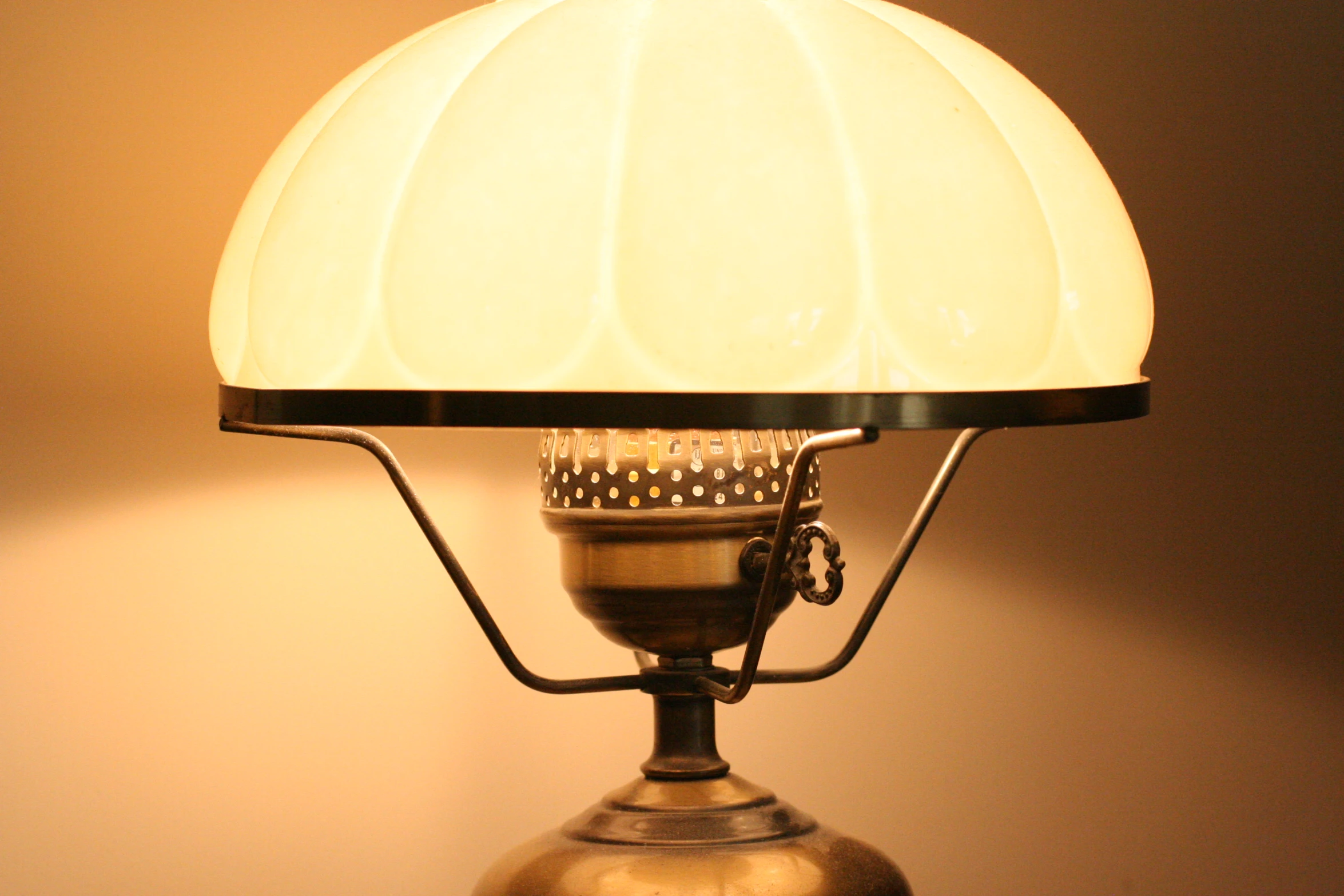 a lamp with a large white shade on top of it