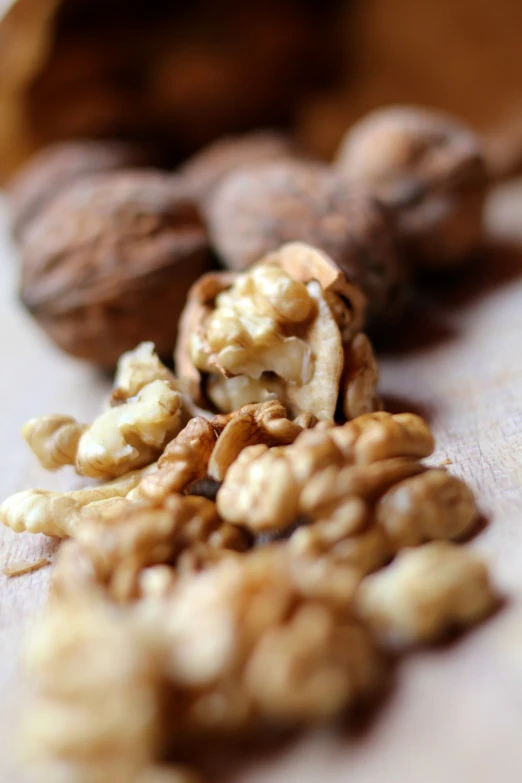 close up of nuts and walnuts on a piece of paper