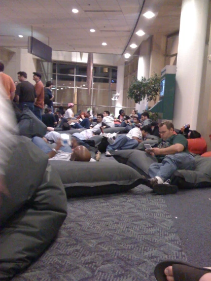 a room full of people sleeping in mattresses