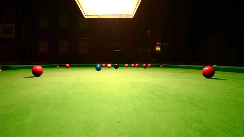 a pool table with three blue balls and two red balls