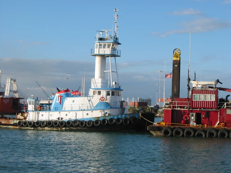 a tug boat tied up to a dock