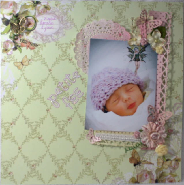 a frame holding a pograph of a baby in it