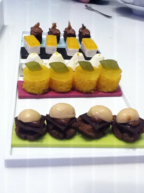 different desserts sit on serving platters on a table