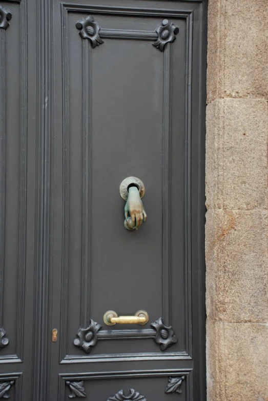 the door to the building is painted in a color of grey