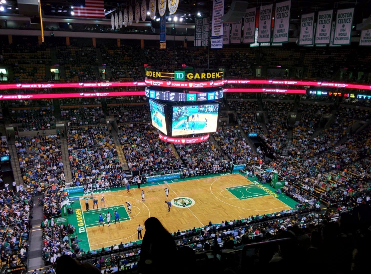 an overhead view of a basketball game on a stadium court