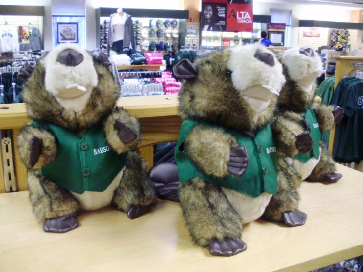 stuffed teddy bears sitting in front of a counter