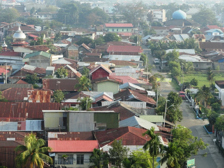 an image of an aerial view of a village with rooftops