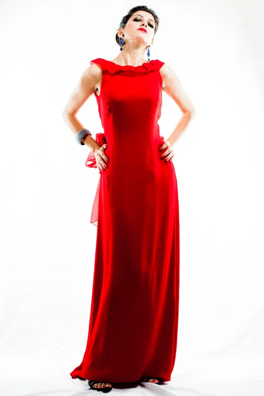 a woman in a red dress standing up