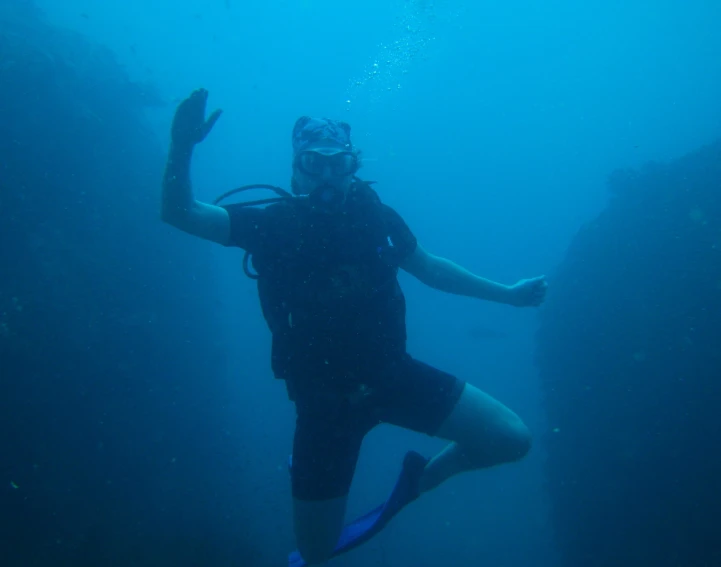 a man is swimming under the water in an open area