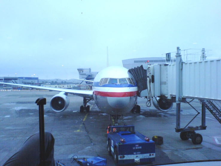 a big commercial airplane parked on the tarmac