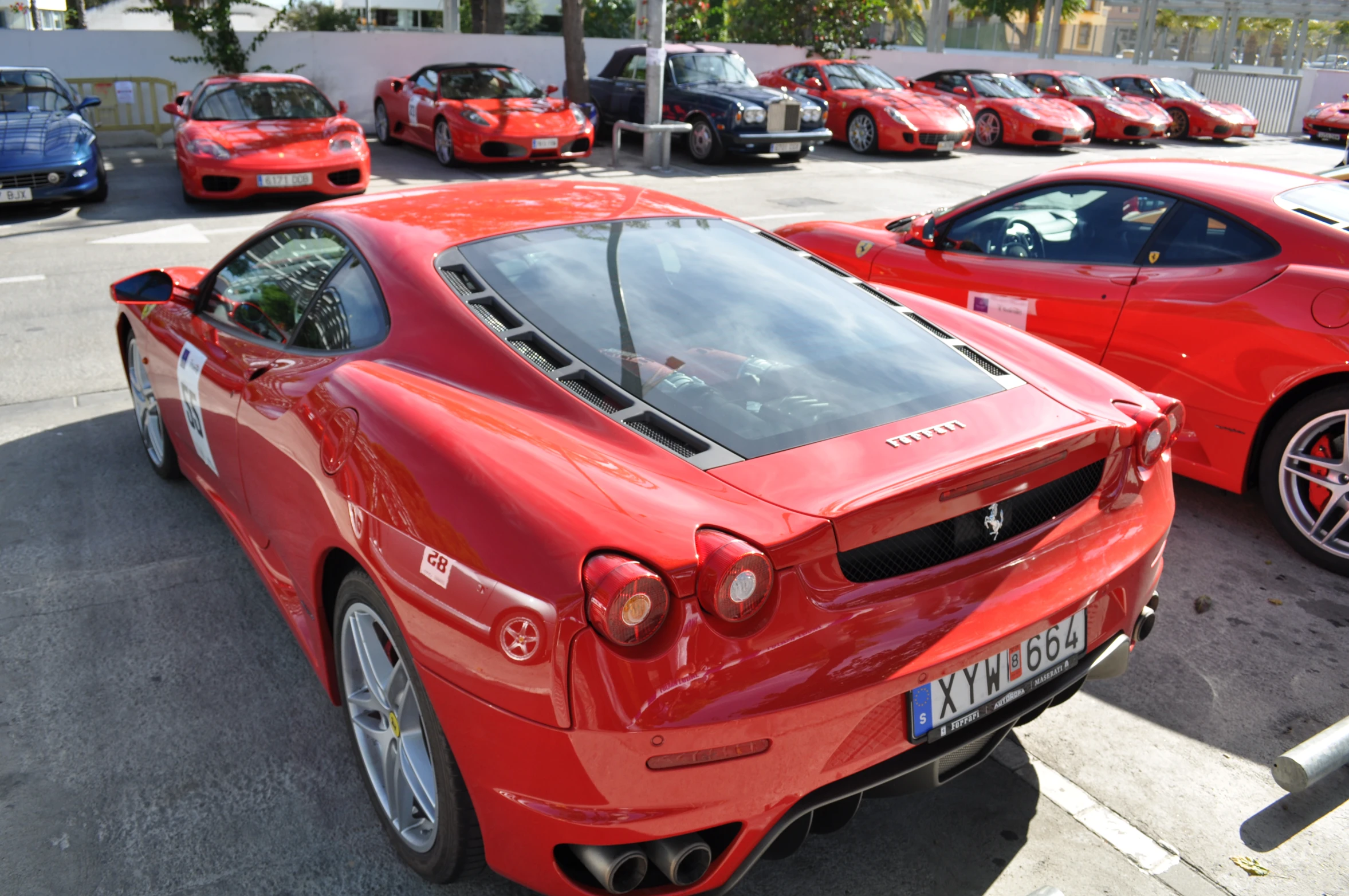 the red ferrari has been parked in the lot for almost a year