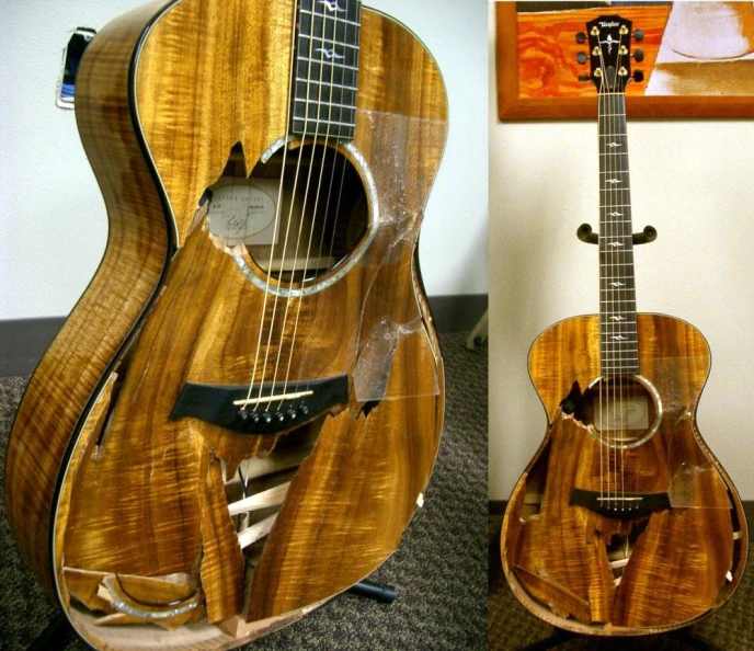 a guitar sitting on a display case next to another instrument