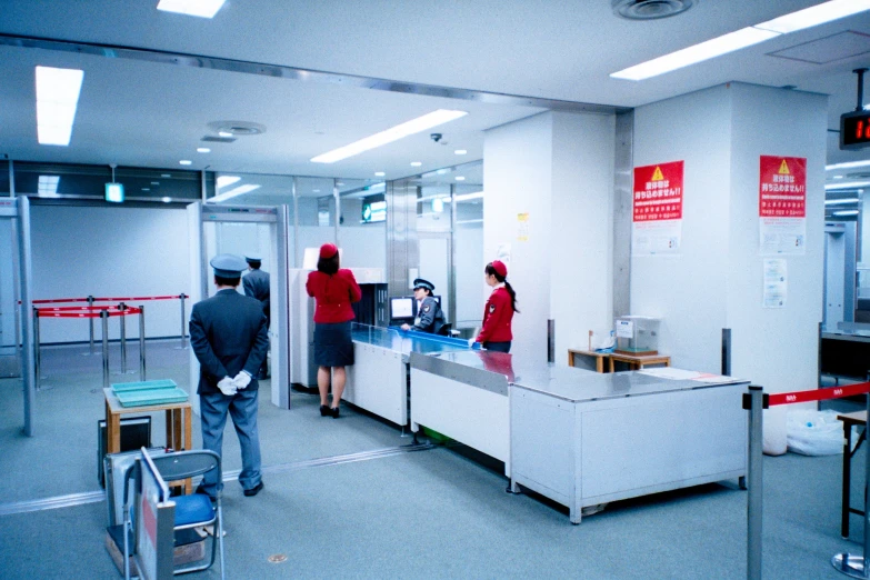 the people are waiting at the baggage claim check - in counter