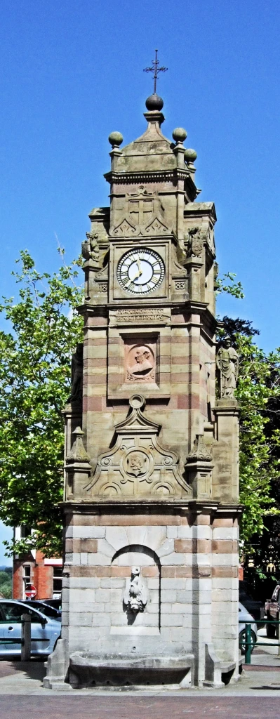 an image of a large brick building with a clock on it