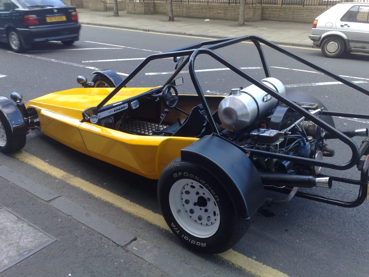 an all - terrain buggy parked on the side of the street