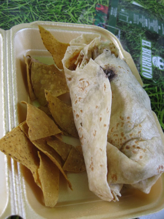 a close up of a plate with chips and tortilla