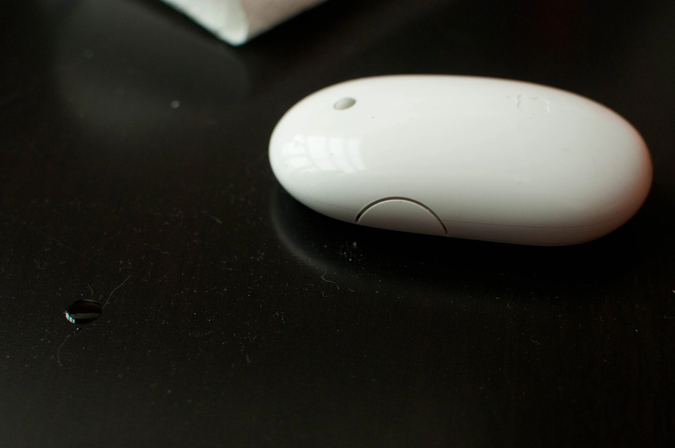 an electronic mouse sits on top of a table