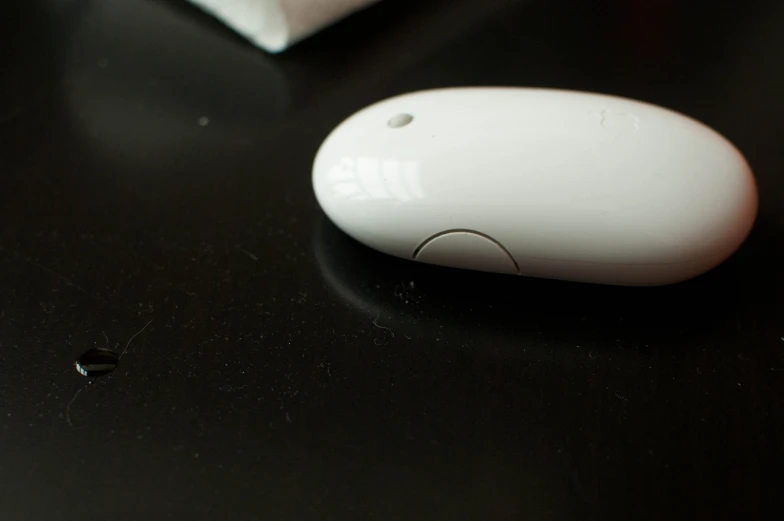 an electronic mouse sits on top of a table