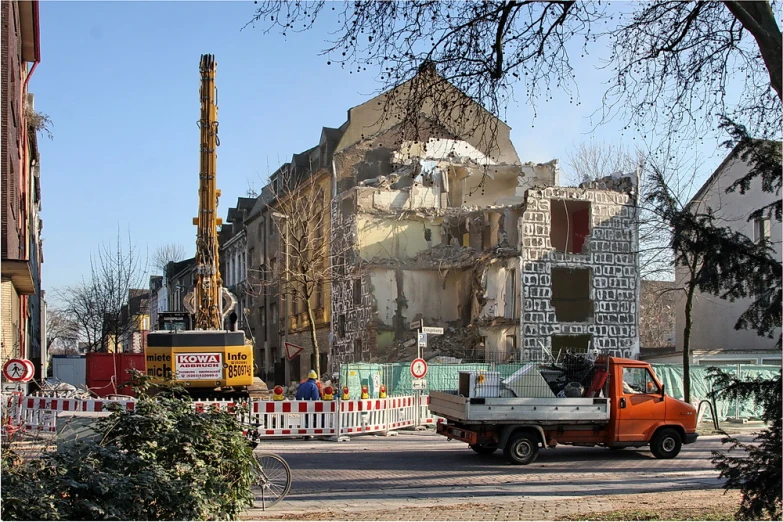 the street is lined with construction and tall buildings