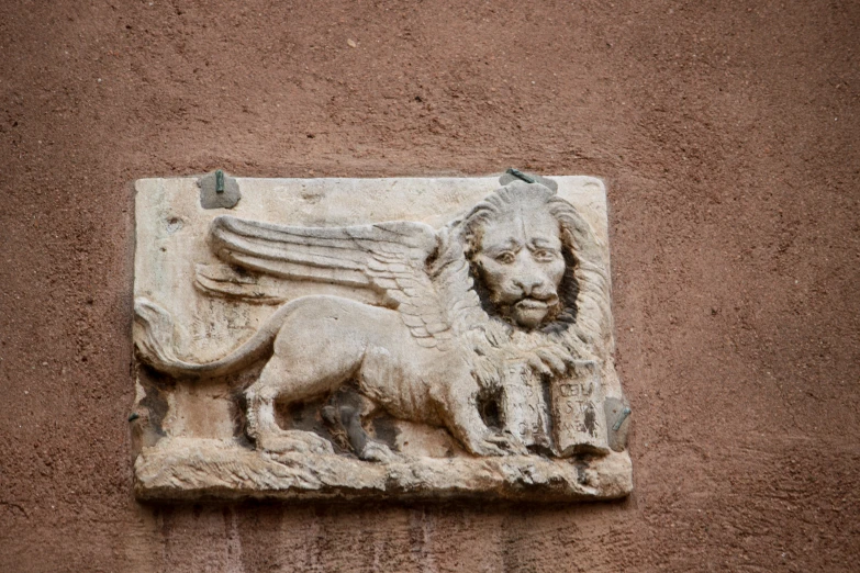 a stone carving with lions on the outside