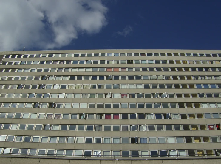 an odd looking building with many windows in it