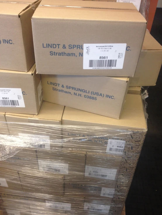 several boxes are stacked on a pallet to be packed