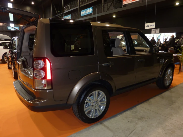 the back end of an suv that is on display at a show