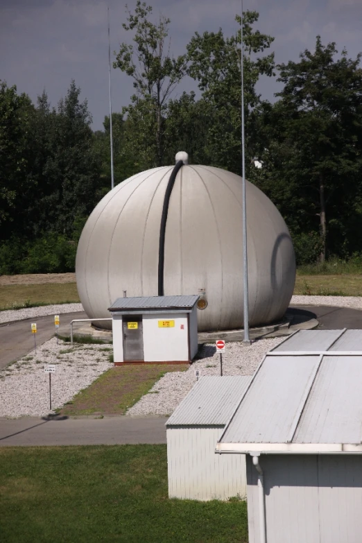 large dome shaped cement structure next to field