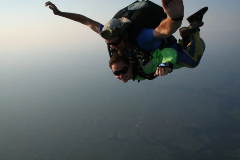 a man flying through the air while being para - sails