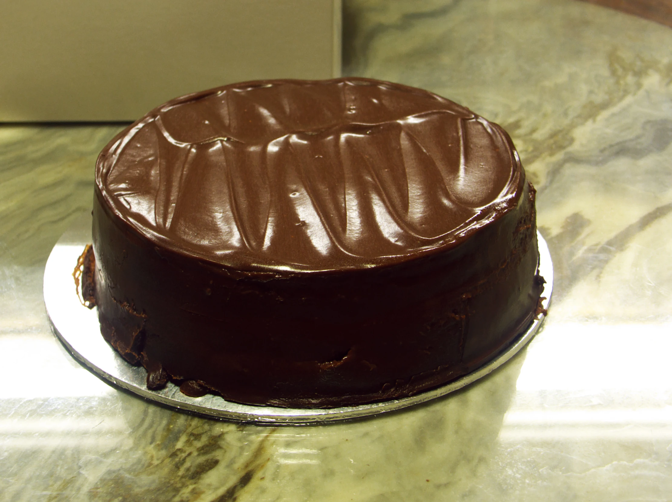 a chocolate cake sitting on top of a table