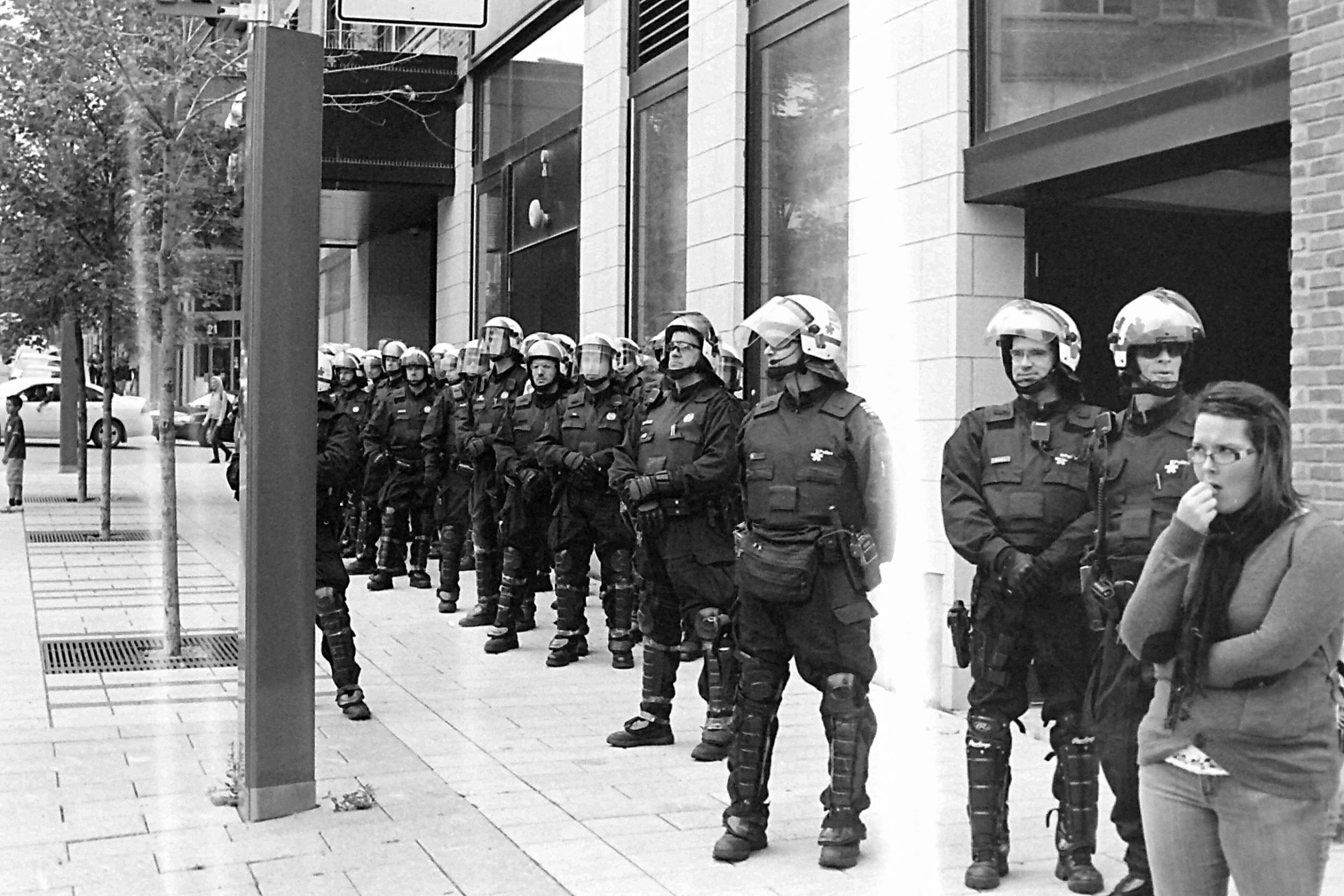 the line of police officers are standing in formation