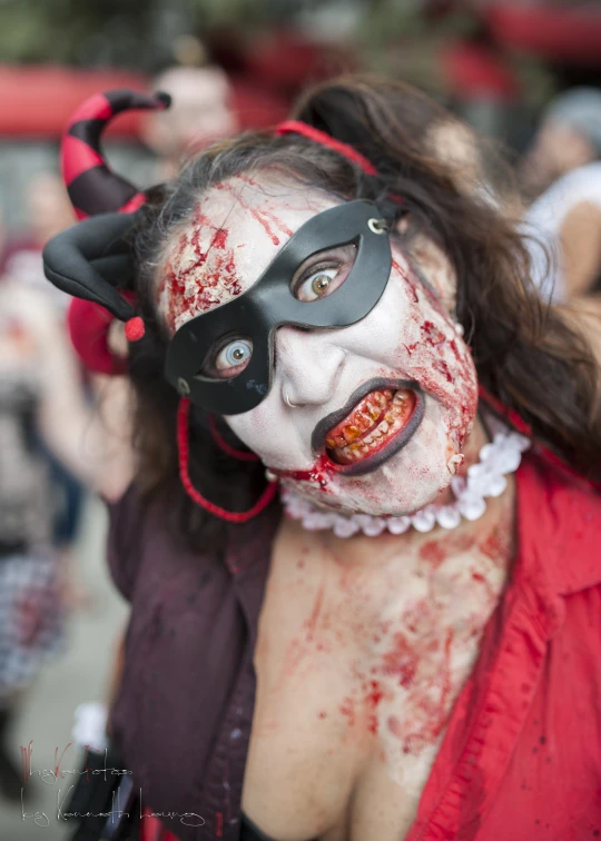 woman dressed in zombie costume posing for camera